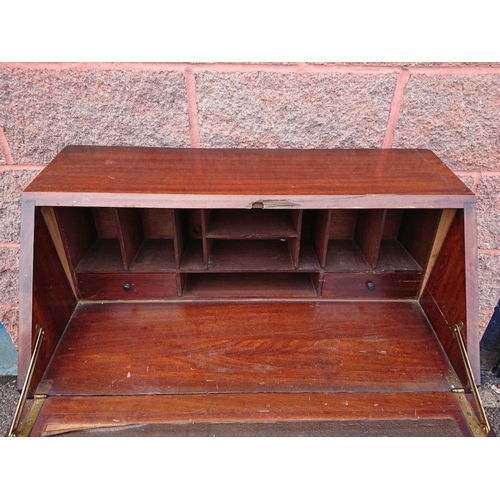 123 - A MAHOGANY WRITING BUREAU, lift top opening to fitted interior, above three drawers with brass drop ... 