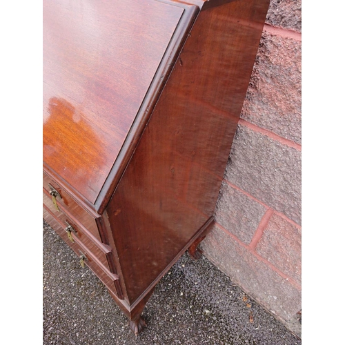 123 - A MAHOGANY WRITING BUREAU, lift top opening to fitted interior, above three drawers with brass drop ... 