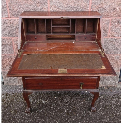 123 - A MAHOGANY WRITING BUREAU, lift top opening to fitted interior, above three drawers with brass drop ... 