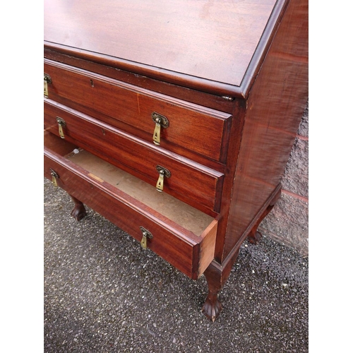 123 - A MAHOGANY WRITING BUREAU, lift top opening to fitted interior, above three drawers with brass drop ... 