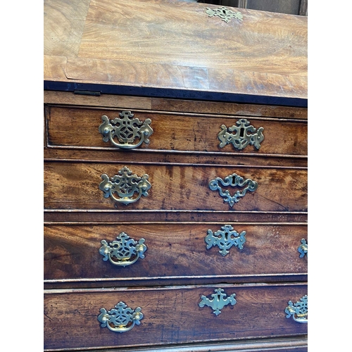 125 - A 19TH CENTURY BURR WALNUT WRITING BUREAU, with brass handles, fall front opening to fitted interior... 
