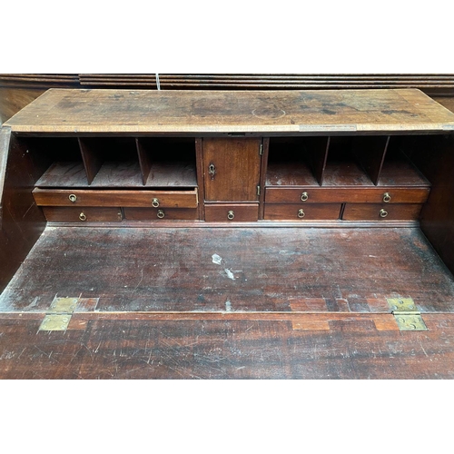 125 - A 19TH CENTURY BURR WALNUT WRITING BUREAU, with brass handles, fall front opening to fitted interior... 
