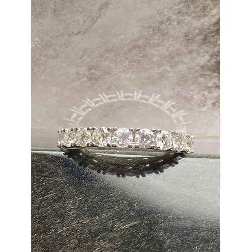 132 - AN EXQUISITE 18CT WHITE GOLD DIAMOND HALF ETERNITY RING, diamonds claw set, nine brilliant cut diamo... 