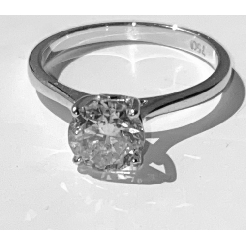 134 - A STUNNING 18CT WHITE GOLD SOLITAIRE RING, this superb round brilliant cut diamond is set in a four ... 