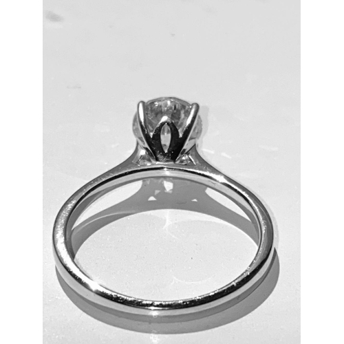 134 - A STUNNING 18CT WHITE GOLD SOLITAIRE RING, this superb round brilliant cut diamond is set in a four ... 