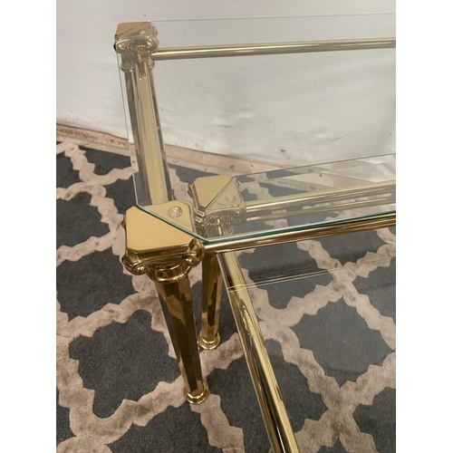 138 - A GOOD QUALITY NEST OF THREE BRASS TABLES, with bevelled glass tops on brass Corinthian column legs.... 