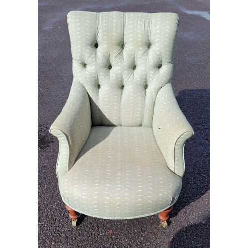 159 - A GOOD QUALITY 'SUSIE WATSON' BUTTON BACKED ARM CHAIR, with bow front shape, raised on tapered turne... 