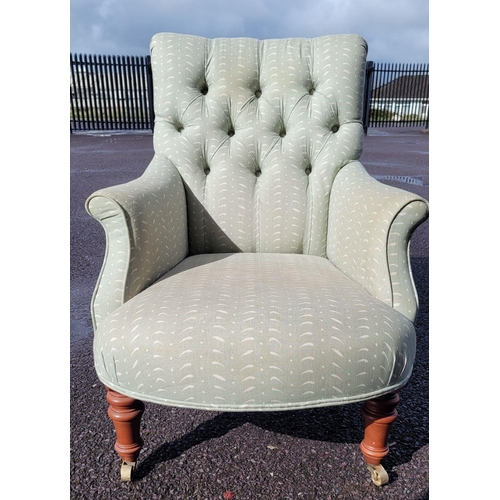 159 - A GOOD QUALITY 'SUSIE WATSON' BUTTON BACKED ARM CHAIR, with bow front shape, raised on tapered turne... 