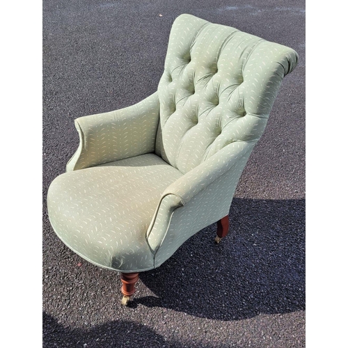 159 - A GOOD QUALITY 'SUSIE WATSON' BUTTON BACKED ARM CHAIR, with bow front shape, raised on tapered turne... 