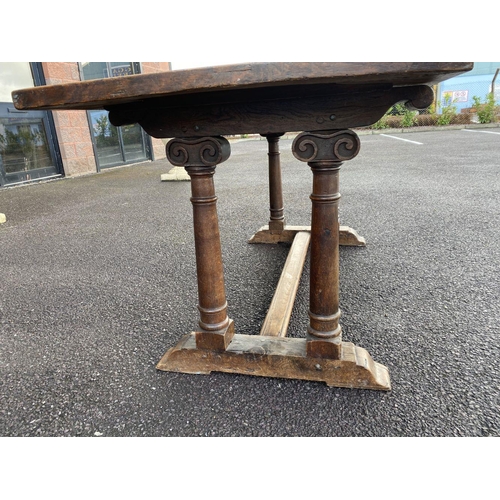 164 - AN 18TH CENTURY MAHOGANY REFECTORY TABLE, with carved supports to pedestal base with cross stretcher... 