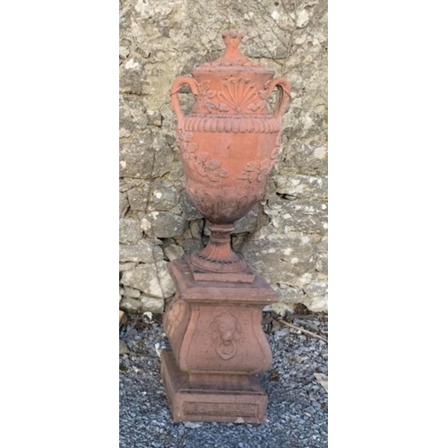 166 - A WONDERFUL PAIR OF TERECOTTA GARDEN URNS ON PLINTHS, urns of traditional form with two handles and ... 