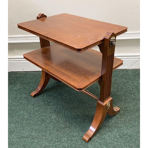 170 - A MAHOGANY CROSSBANDED TWO TIER SIDE TABLE, fluted side supports with brass lion handles, turned cro... 