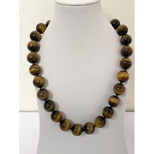 175 - A TIGERSEYE BEADED NECKLACE, lovely tigerseye beads with silver tone clasp. Dimensions: 50cm long ap... 