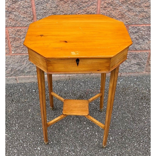 28 - A MID CENTURY OCTAGONAL BIRCH SEWING TABLE, opening to fitter interior, supported by tapered legs un... 