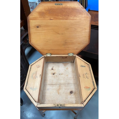 28 - A MID CENTURY OCTAGONAL BIRCH SEWING TABLE, opening to fitter interior, supported by tapered legs un... 