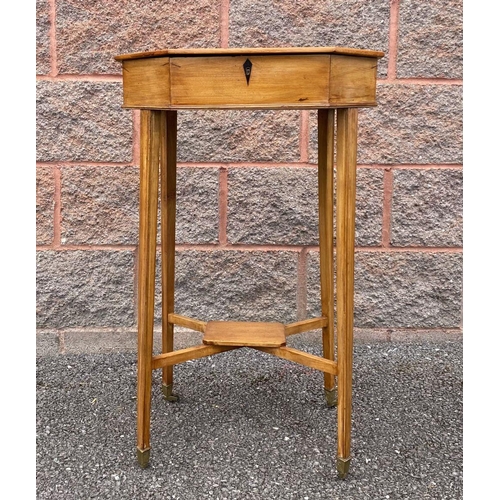 28 - A MID CENTURY OCTAGONAL BIRCH SEWING TABLE, opening to fitter interior, supported by tapered legs un... 