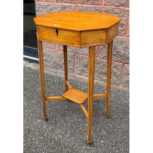 28 - A MID CENTURY OCTAGONAL BIRCH SEWING TABLE, opening to fitter interior, supported by tapered legs un... 