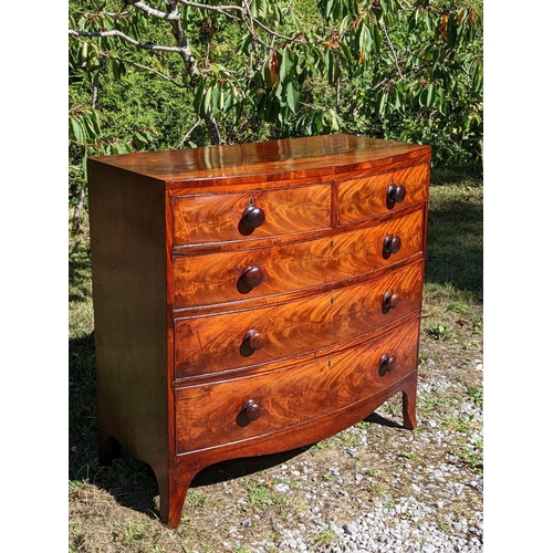 3 - A GEORGIAN MAHOGANY BOW FRONTED CHEST OF DRAWERS, c.1800, with beautifully patinated flame mahogany ... 