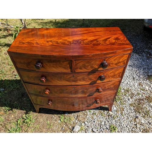 3 - A GEORGIAN MAHOGANY BOW FRONTED CHEST OF DRAWERS, c.1800, with beautifully patinated flame mahogany ... 