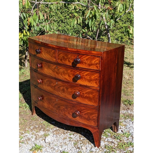 3 - A GEORGIAN MAHOGANY BOW FRONTED CHEST OF DRAWERS, c.1800, with beautifully patinated flame mahogany ... 