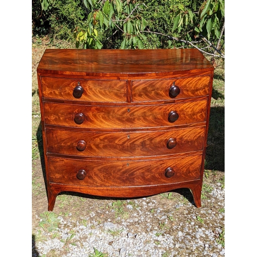 3 - A GEORGIAN MAHOGANY BOW FRONTED CHEST OF DRAWERS, c.1800, with beautifully patinated flame mahogany ... 