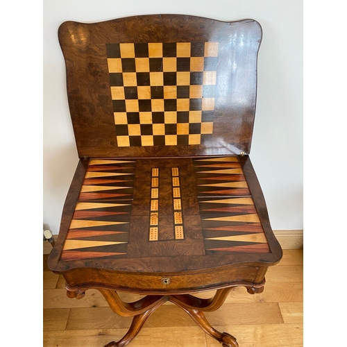 30 - AN EXCELLENT VICTORIAN BURR WALNUT GAMES TABLE, shaped top with draught board and backgammon to inte... 