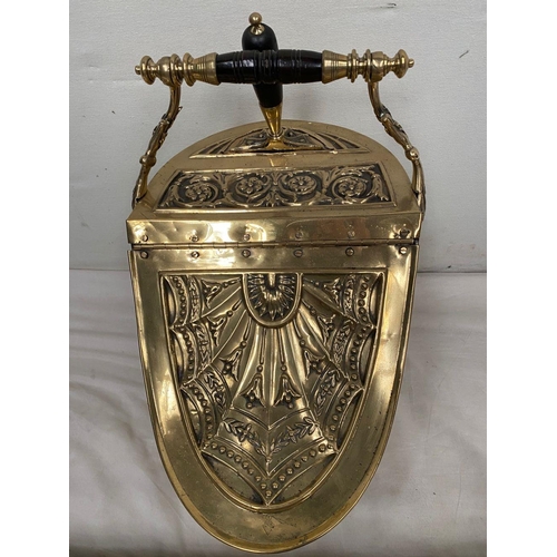 31 - A DECORATIVE VICTORIAN BRASS COAL BUCKET, with embossed design panel to front, top and sides, shovel... 