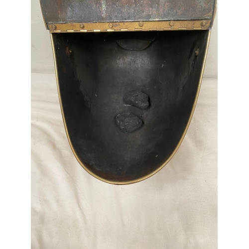 31 - A DECORATIVE VICTORIAN BRASS COAL BUCKET, with embossed design panel to front, top and sides, shovel... 