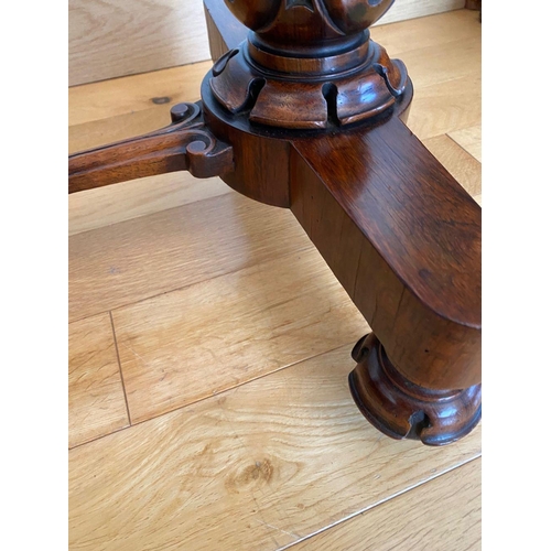 48 - A WILLIAM IV ROSEWOOD GAMES TABLE, with draught board to interior, standing on column legs supported... 