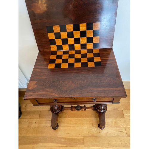 48 - A WILLIAM IV ROSEWOOD GAMES TABLE, with draught board to interior, standing on column legs supported... 