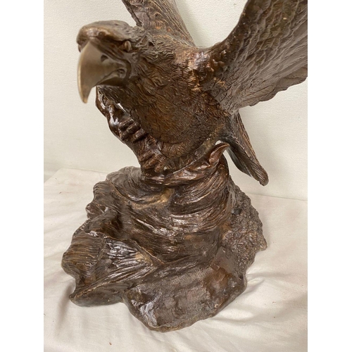 6 - A FINELY CAST BRONZE SCULPTURE OF AN EAGLE, with wings open, perched on shaped base. Dimensions: 58c... 