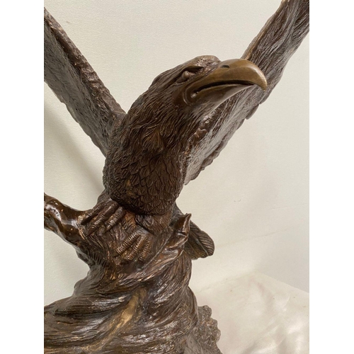 6 - A FINELY CAST BRONZE SCULPTURE OF AN EAGLE, with wings open, perched on shaped base. Dimensions: 58c... 