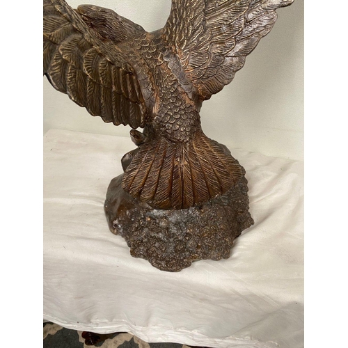 6 - A FINELY CAST BRONZE SCULPTURE OF AN EAGLE, with wings open, perched on shaped base. Dimensions: 58c... 