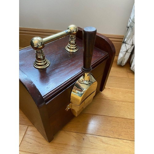 84 - A MAHOGANY SLOPE FRONT COAL BOX with brass handle to top, shaped sides, panelled front with brass ha... 