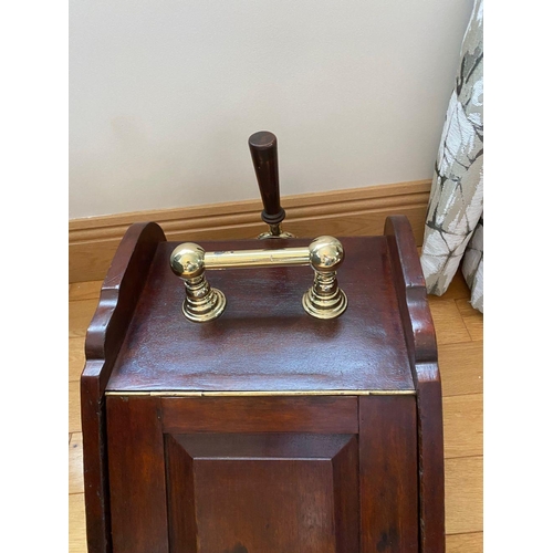 84 - A MAHOGANY SLOPE FRONT COAL BOX with brass handle to top, shaped sides, panelled front with brass ha... 