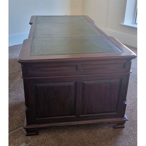 97 - A VERY FINE MAHOGANY LEATHER TOPPED PARTNERS DESK, the concave break front to the front and back add... 