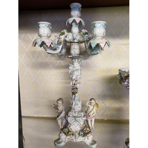 105 - AN ANTIQUE GERMAN SITZENDORF CENTREPIECE AND PAIR OF MEISSEN PORCELAIN CANDLEABRA, with five branche... 