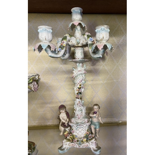 105 - AN ANTIQUE GERMAN SITZENDORF CENTREPIECE AND PAIR OF MEISSEN PORCELAIN CANDLEABRA, with five branche... 