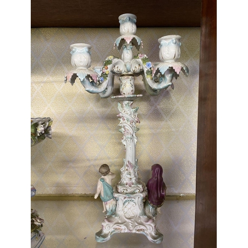 105 - AN ANTIQUE GERMAN SITZENDORF CENTREPIECE AND PAIR OF MEISSEN PORCELAIN CANDLEABRA, with five branche... 