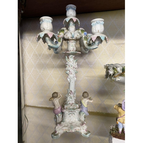 105 - AN ANTIQUE GERMAN SITZENDORF CENTREPIECE AND PAIR OF MEISSEN PORCELAIN CANDLEABRA, with five branche... 