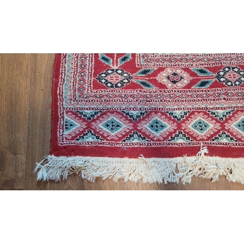 110 - A GOOD QUALITY HAND WOVEN KURDISH NORTHWEST PERSIAN FLOOR RUG, main ground colour red, with unusual ... 