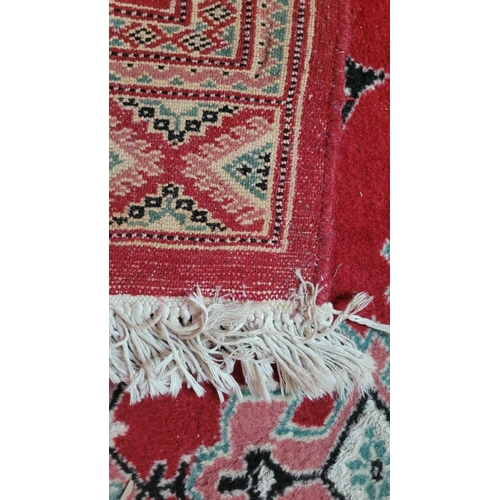 110 - A GOOD QUALITY HAND WOVEN KURDISH NORTHWEST PERSIAN FLOOR RUG, main ground colour red, with unusual ... 