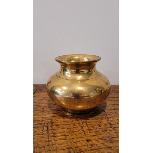 112 - A GOOD BRASS LOT; includes a pair of enamel painted brass candlesticks, a jug and bowl (4)