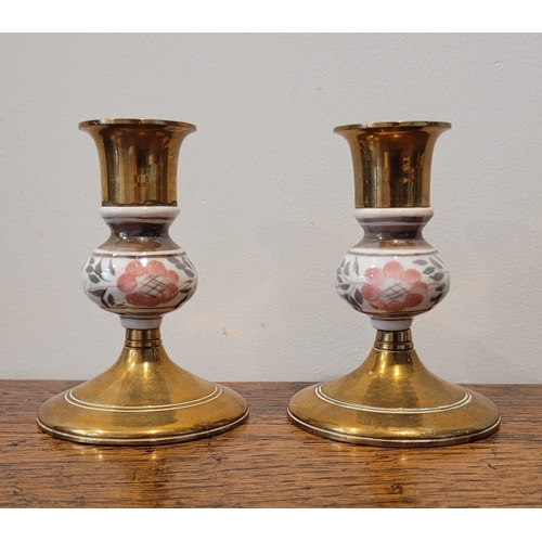 112 - A GOOD BRASS LOT; includes a pair of enamel painted brass candlesticks, a jug and bowl (4)