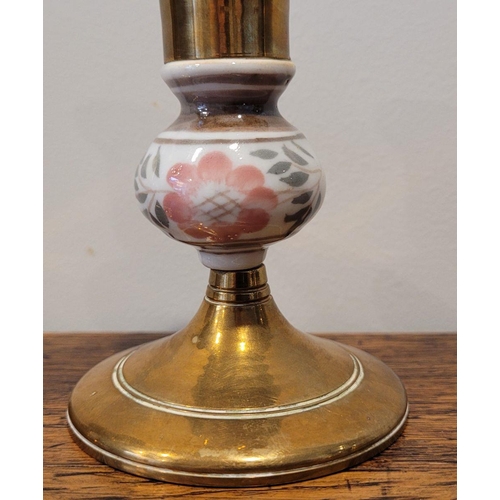 112 - A GOOD BRASS LOT; includes a pair of enamel painted brass candlesticks, a jug and bowl (4)