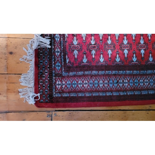 113 - A VERY GOOD QUALITY PERSIAN TURKMAN FLOOR RUG, with multiple gul design to the centre, surrounded by... 