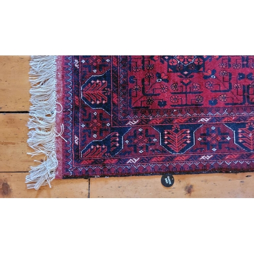 115 - A VERY GOOD QUALITY TURKMAN HANDMADE TRIBAL AFGHAN RUG, with six medallions, main ground red, 160 x ... 