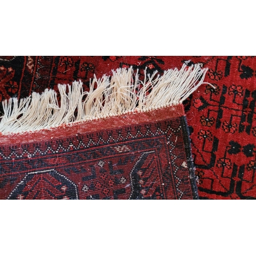 115 - A VERY GOOD QUALITY TURKMAN HANDMADE TRIBAL AFGHAN RUG, with six medallions, main ground red, 160 x ... 