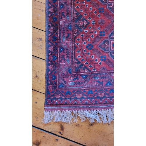 116 - A SMALL BOKHARA TRIBAL FLOOR RUG, with triple floral medallion design to the centre, multiple border... 