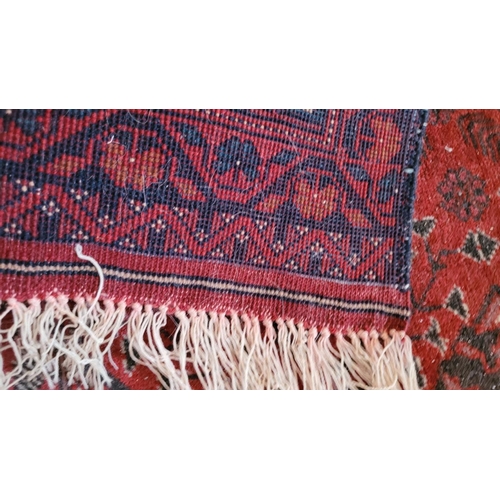 116 - A SMALL BOKHARA TRIBAL FLOOR RUG, with triple floral medallion design to the centre, multiple border... 